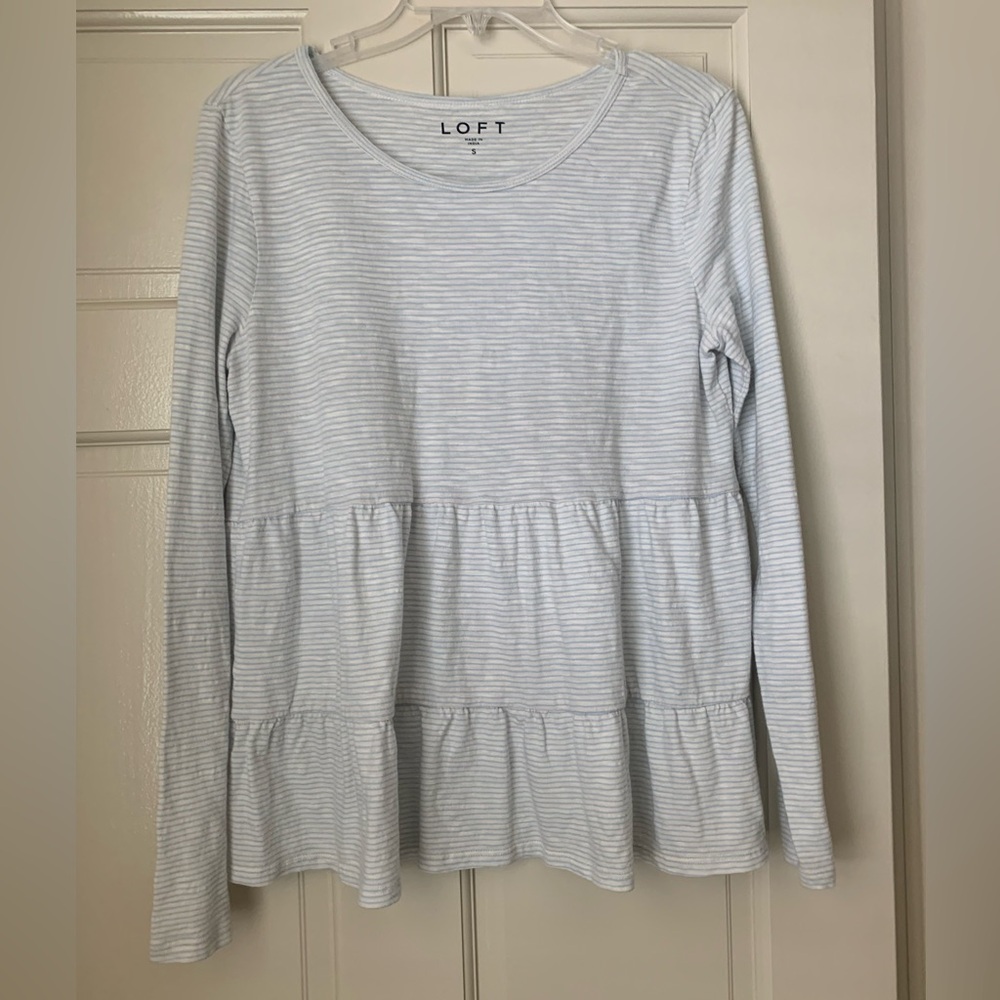 Light blue and white striped top.